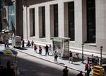 Pedestrians walk along Wall Street near the New York Stock Exchange&nbsp;&nbsp;in New York.