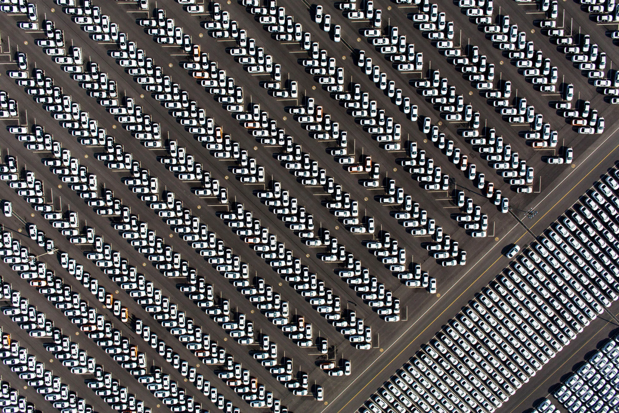 Hyundai vehicles sit parked at a delivery center at the company's factory in this aerial photograph taken in Asan, South Korea.
