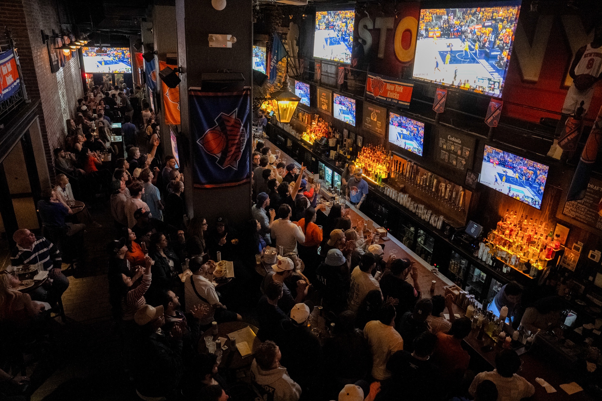 Fans watch the NBA playoffs at a bar in New York on May 31.