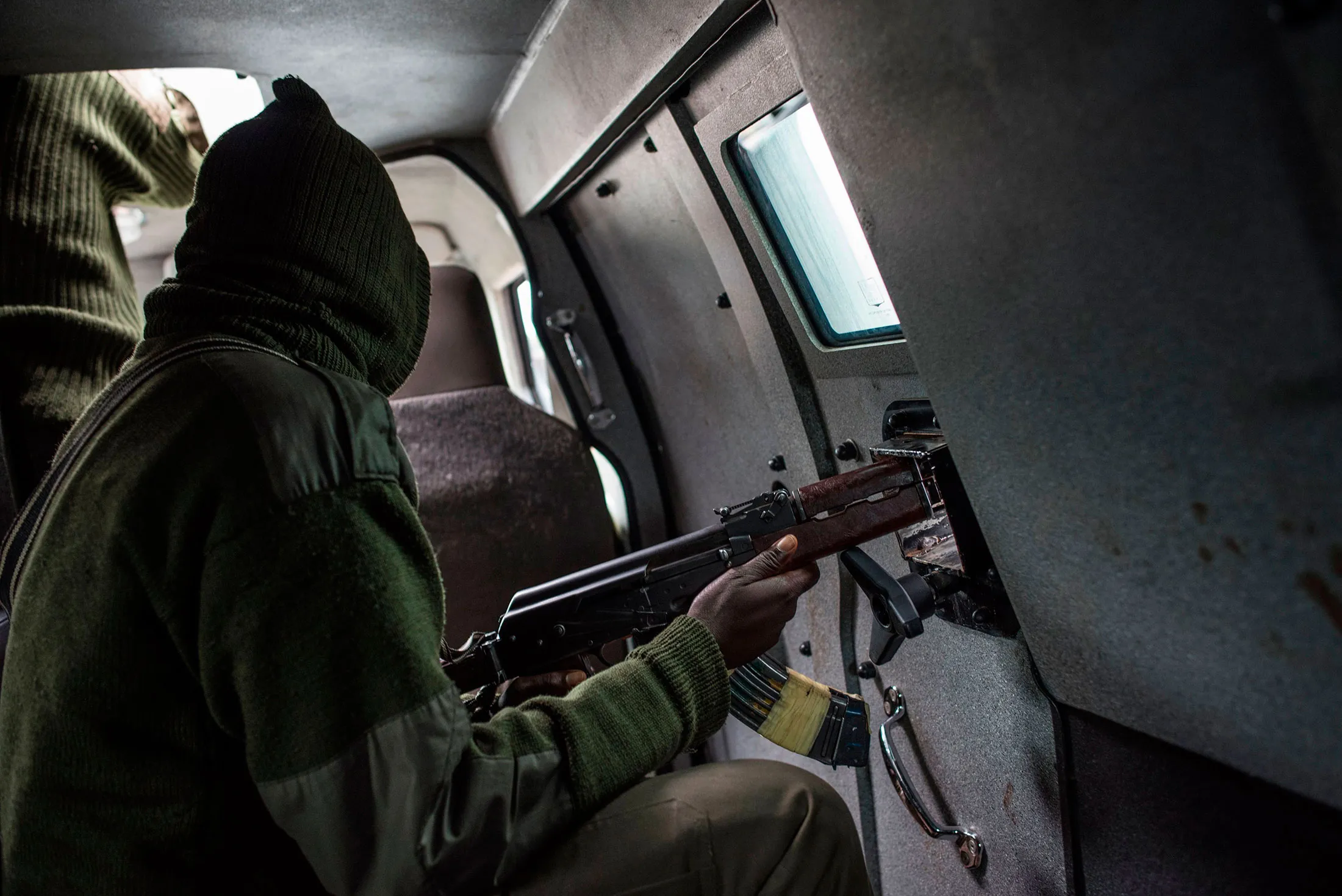 A member of the security forces drives through a Fulani area following violent clashes between farmers and Fulani herders.