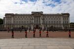 Employees from Buckingham Palace line the procession route during the state funeral of Queen Elizabeth II, in London, UK, on Sept. 19.