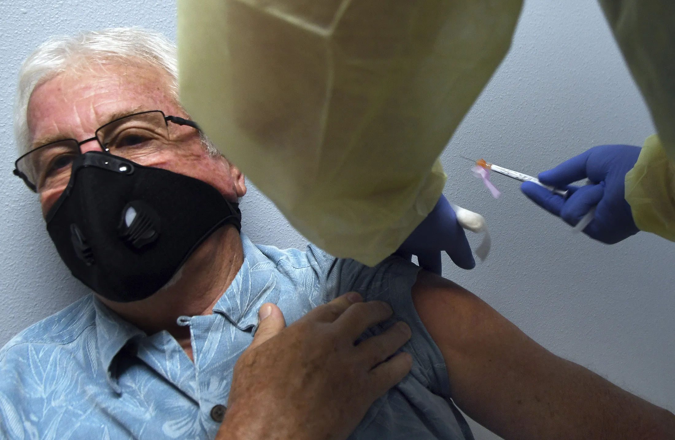 A participant in a Phase 3 COVID-19 vaccine clinical trial sponsored by Moderna&nbsp;gets a shot during the trial.
