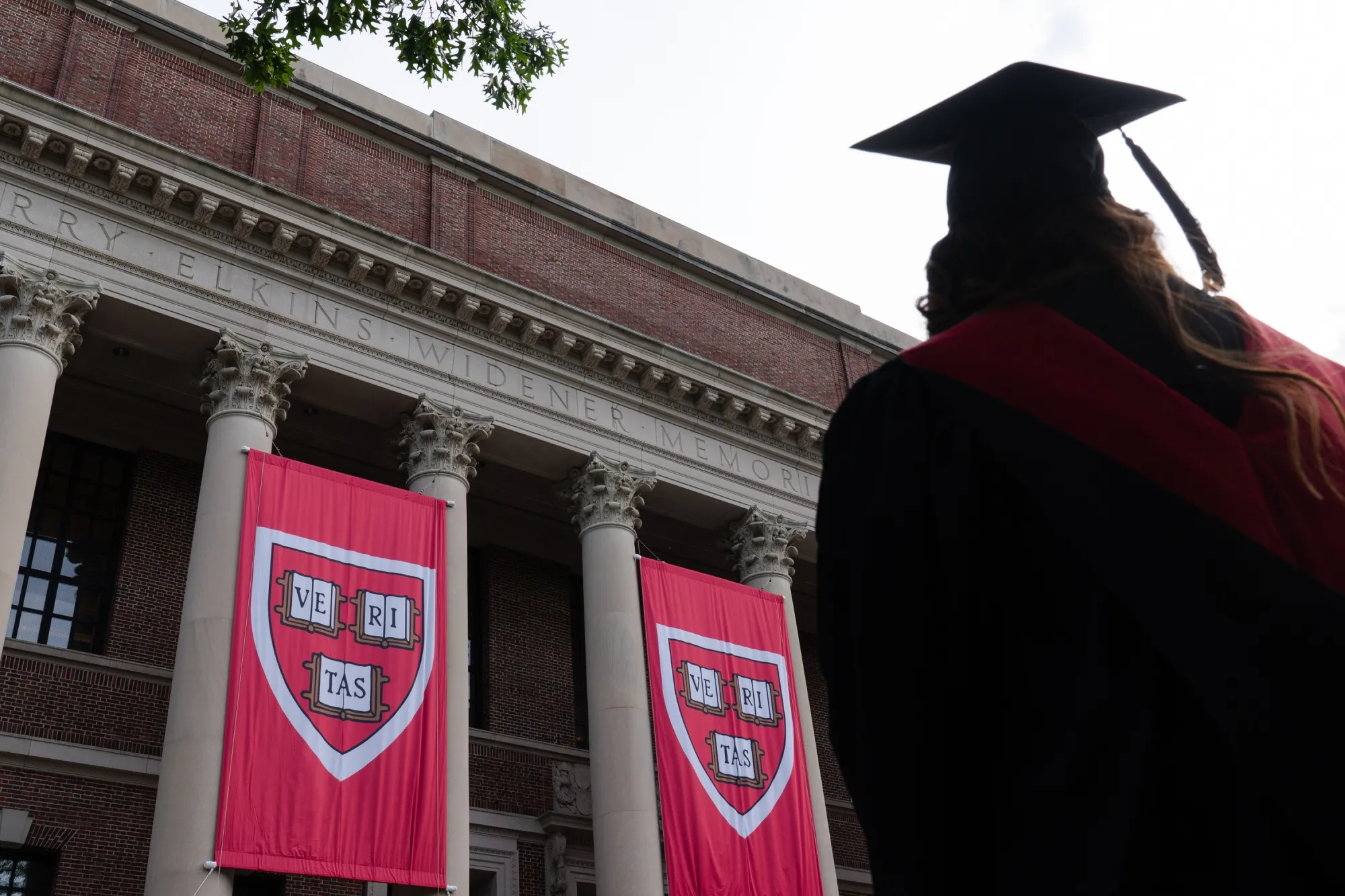 A student in front of the Harry Elkins Widener Memorial Library on the Harvard University campus in Cambridge, Massachusetts.