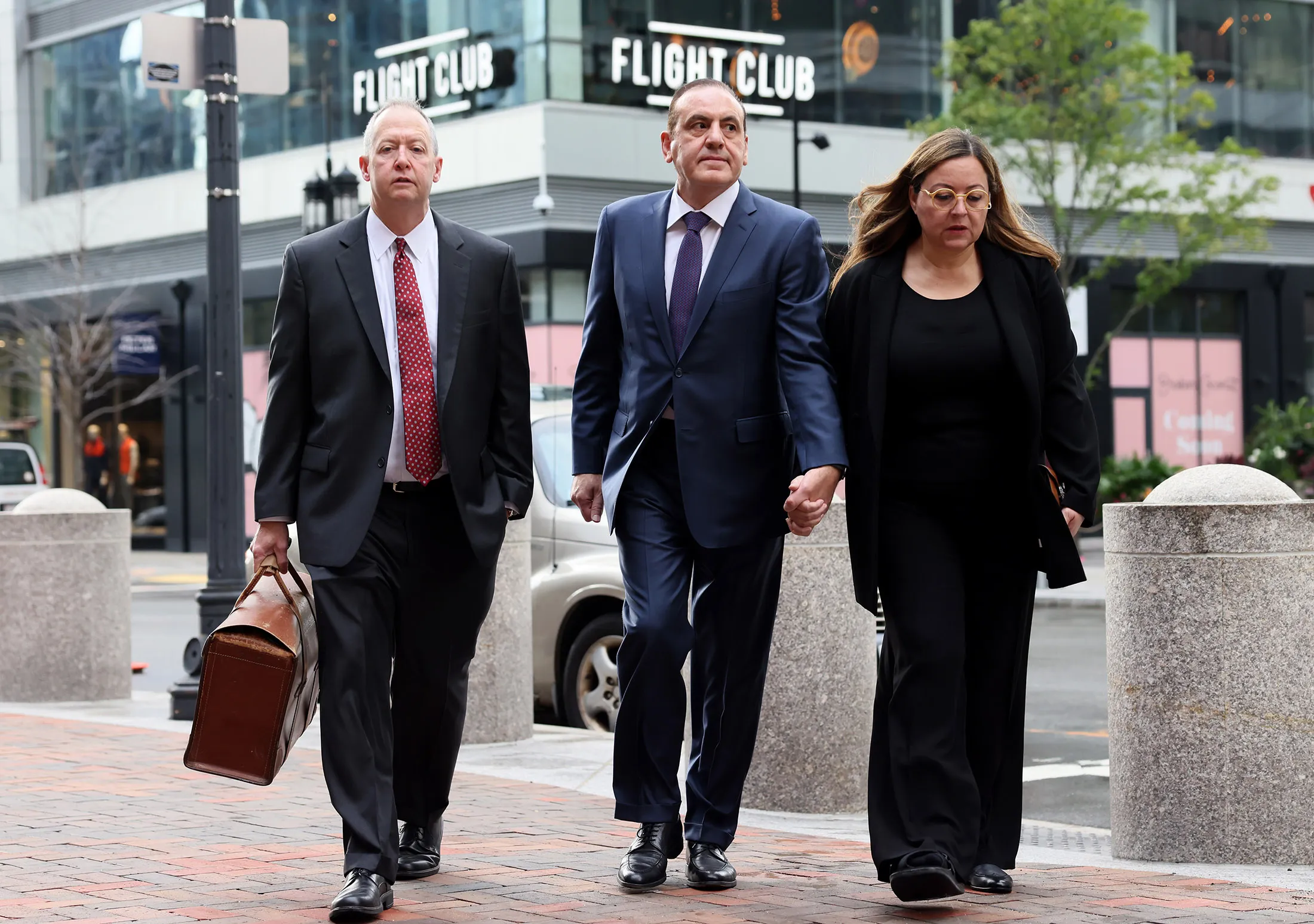 Gamal Abdelaziz, center, arrives at Boston’s U.S. District Court on Sept. 13.