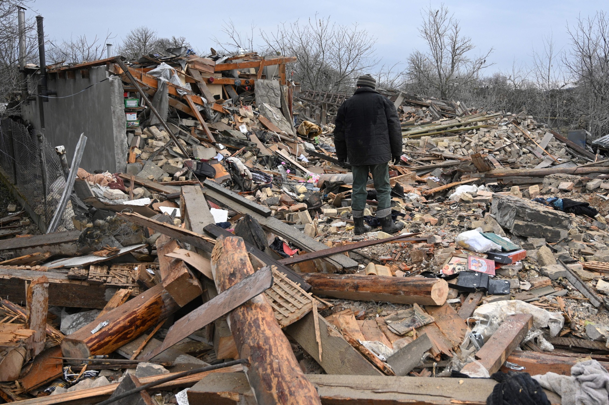 People search rubble of a building destroyed during a Russian strike in Velyka Vilshanytsia, near Lviv on March 9.