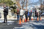 Residents wait in line to receive a Covid-19 test in Allston, Massachusetts, in January.