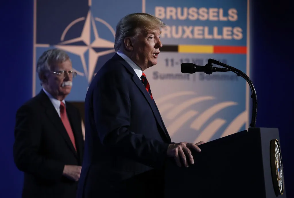 Standing well behind his man.