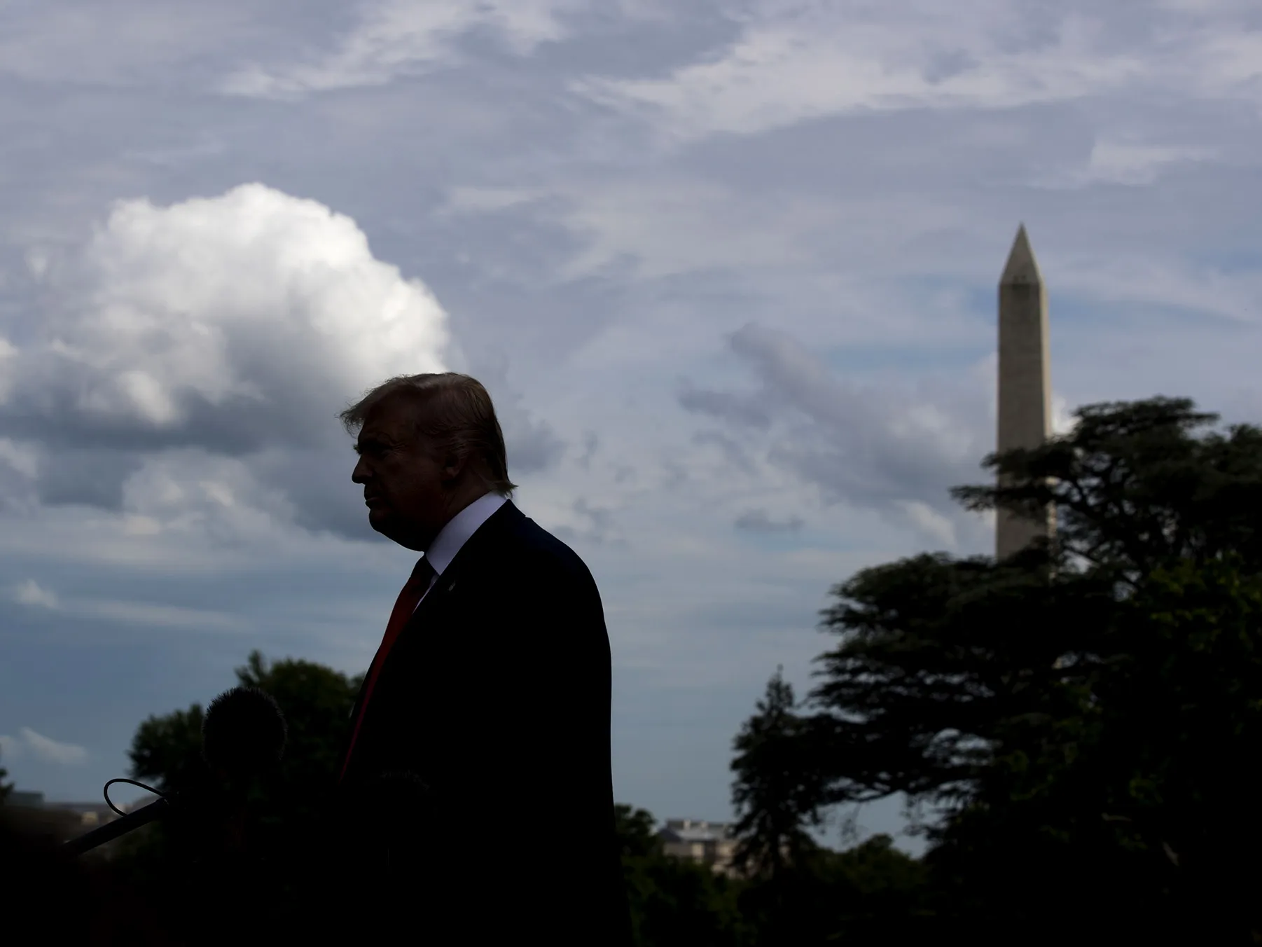 U.S. President Donald Trump speaks to members of the media before boarding Marine One on the South Lawn of the White House in Washington, D.C.
