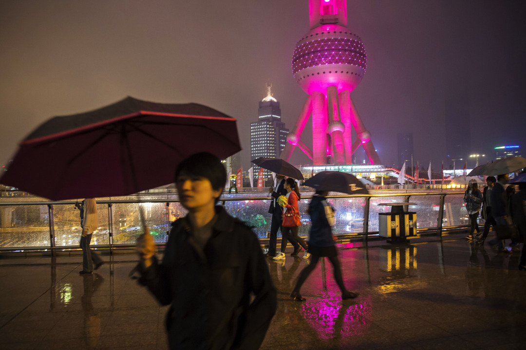 Commuters in the Pudong Business Area of Shanghai as Plenum Concludes