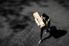 A delivery man wearing a protective mask carries an Amazon box in Paris on April 15.