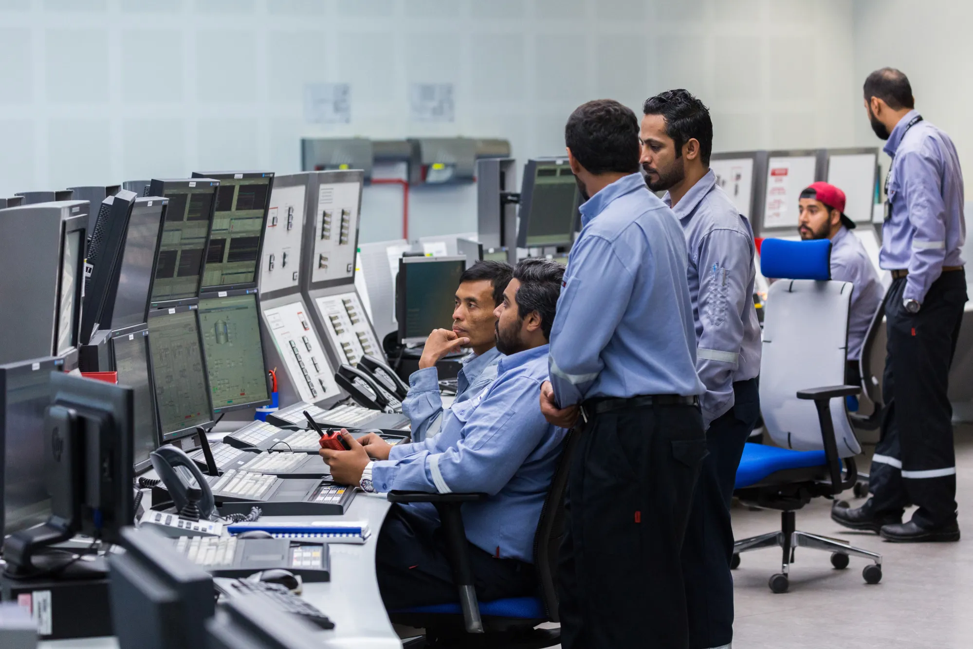 Employees monitor operations data at the Borouge 3 petrochemical plant&nbsp;in Al Ruwais, United Arab Emirates.