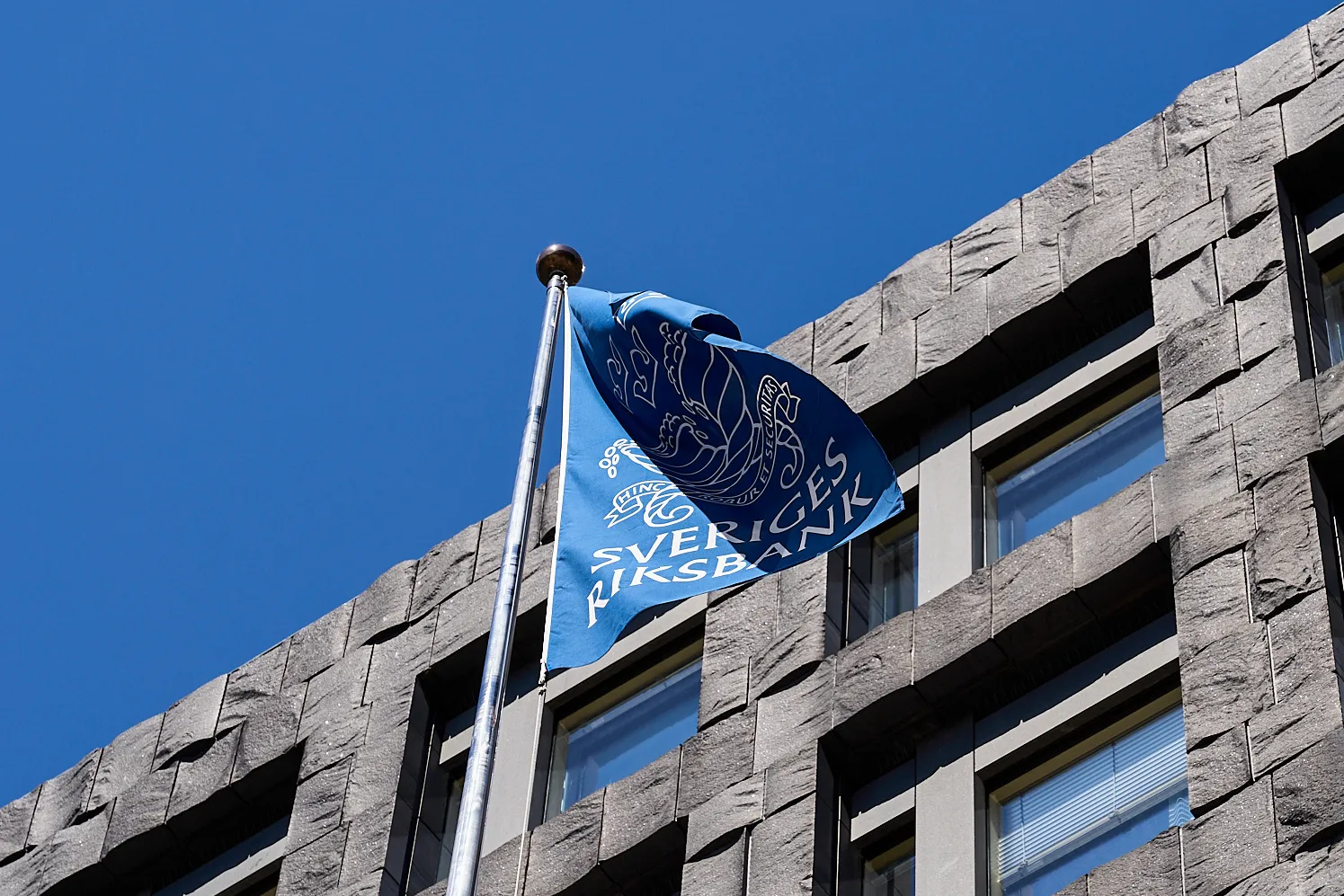 A flag outside the Riksbank headquarters in Stockholm, Sweden.