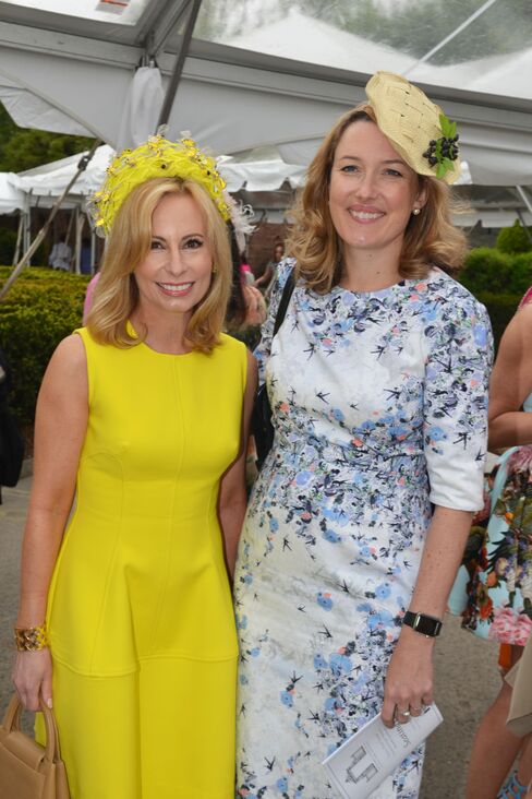 Gillian Miniter in an Eric Javits bee hive hat and Daisy Prince. Photographer: Amanda Gordon/Bloomberg