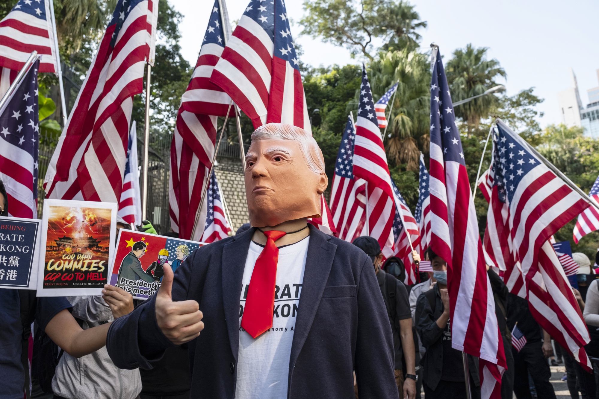 A demonstrator in a Trump mask in Hong Kong in 2019. Activists in Hong Kong hope Biden will continue to enforce the Hong Kong Human Rights and Democracy Act passed by the Trump administration.