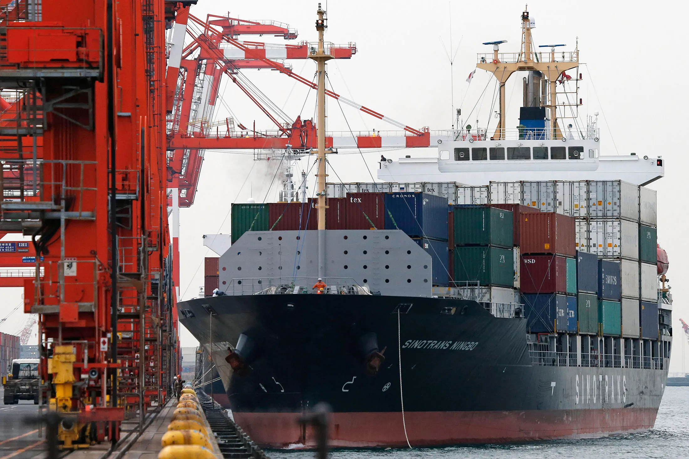 The Sinotrans Ningbo container ship sails out of a shipping terminal in Tokyo, Japan.
