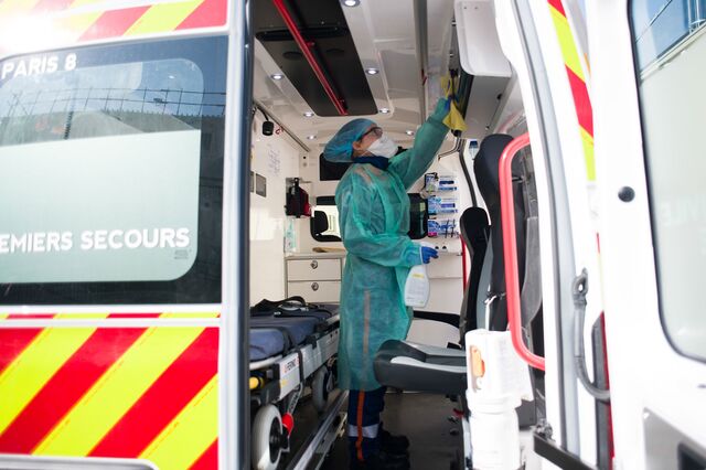 Members of the civil protection ambulance service carry out disinfecting cleaning work in Paris on March 31, 2020.