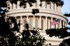 The U.S. flag flies at the U.S. Capitol building in Washington, D.C., U.S., on Friday, July 29, 2011.