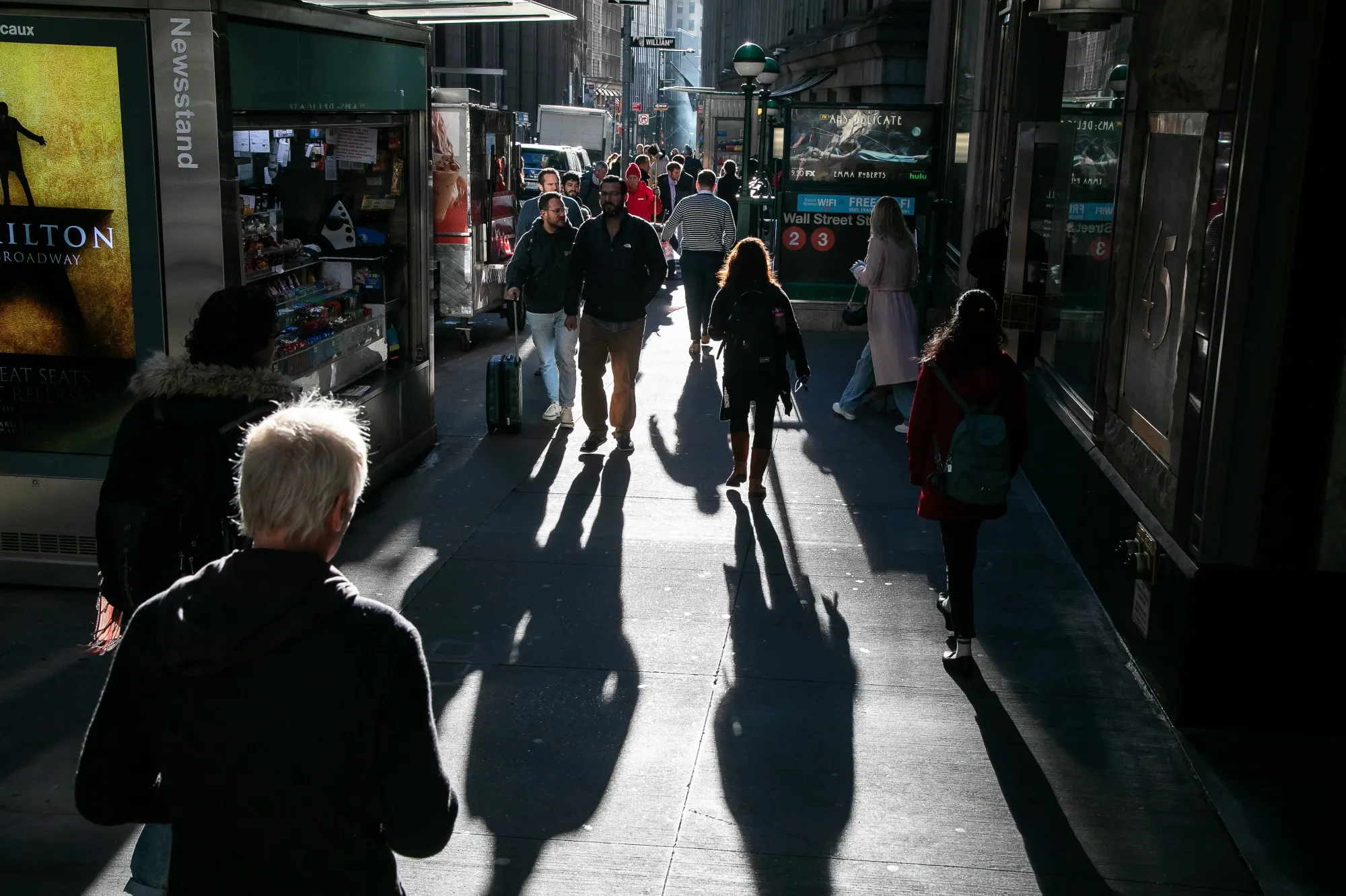 Pedestrians on Wall Street near the New York Stock Exchange.
