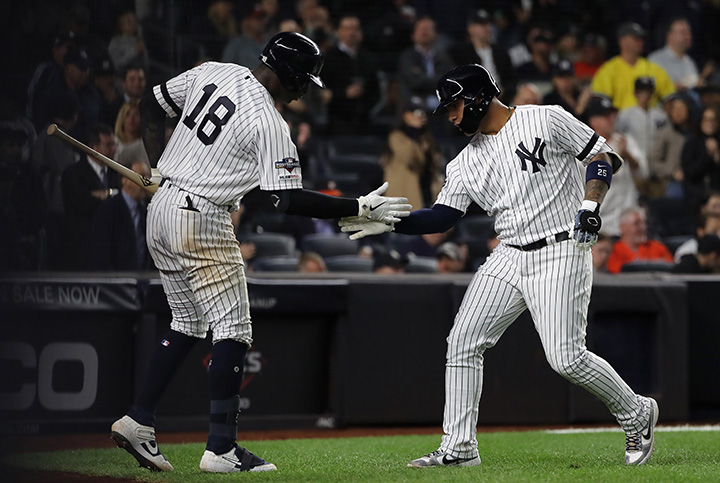 Gleyber Torres #25 of the New York Yankees celebrates with Didi Gregorius #18 after hitting a solo home run&nbsp;against the Houston Astros&nbsp;at Yankee Stadium in New York on Oct.&nbsp;15.