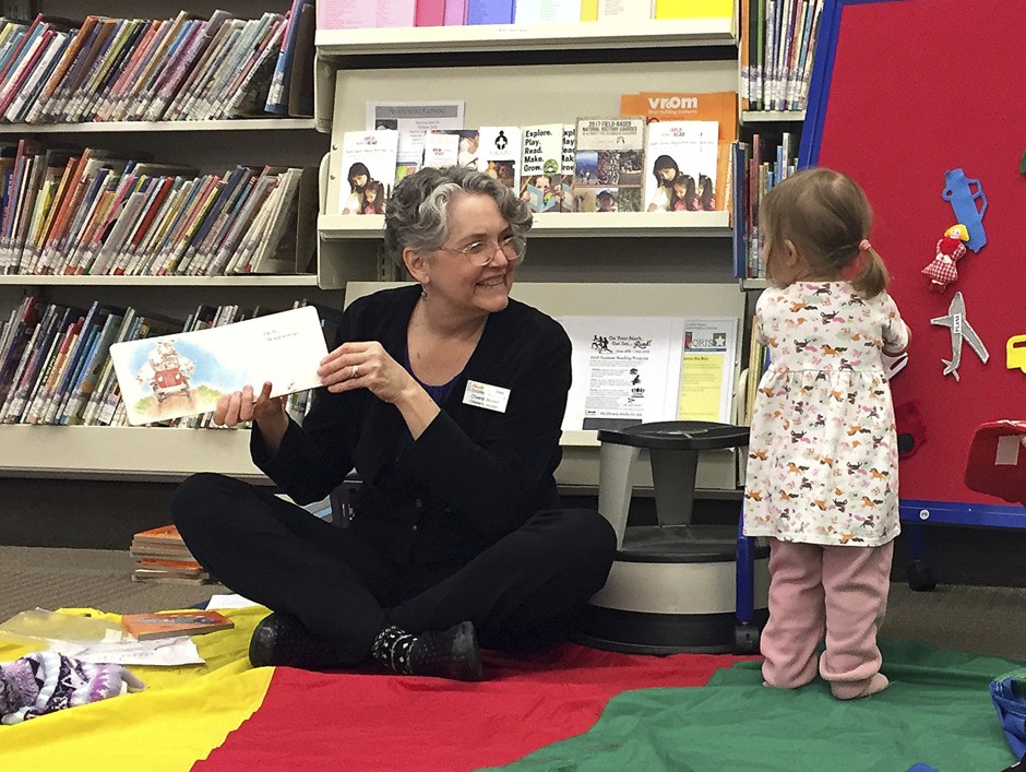 Children's librarian Chere Brown reads to toddlers at the Josephine County library in Grants Pass, Oregon, whose public funding was restored by voters in 2017. 