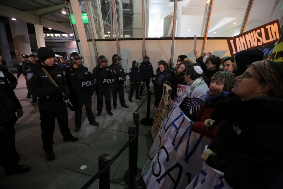 Protesters gather outside JFK Airport in New York City. 