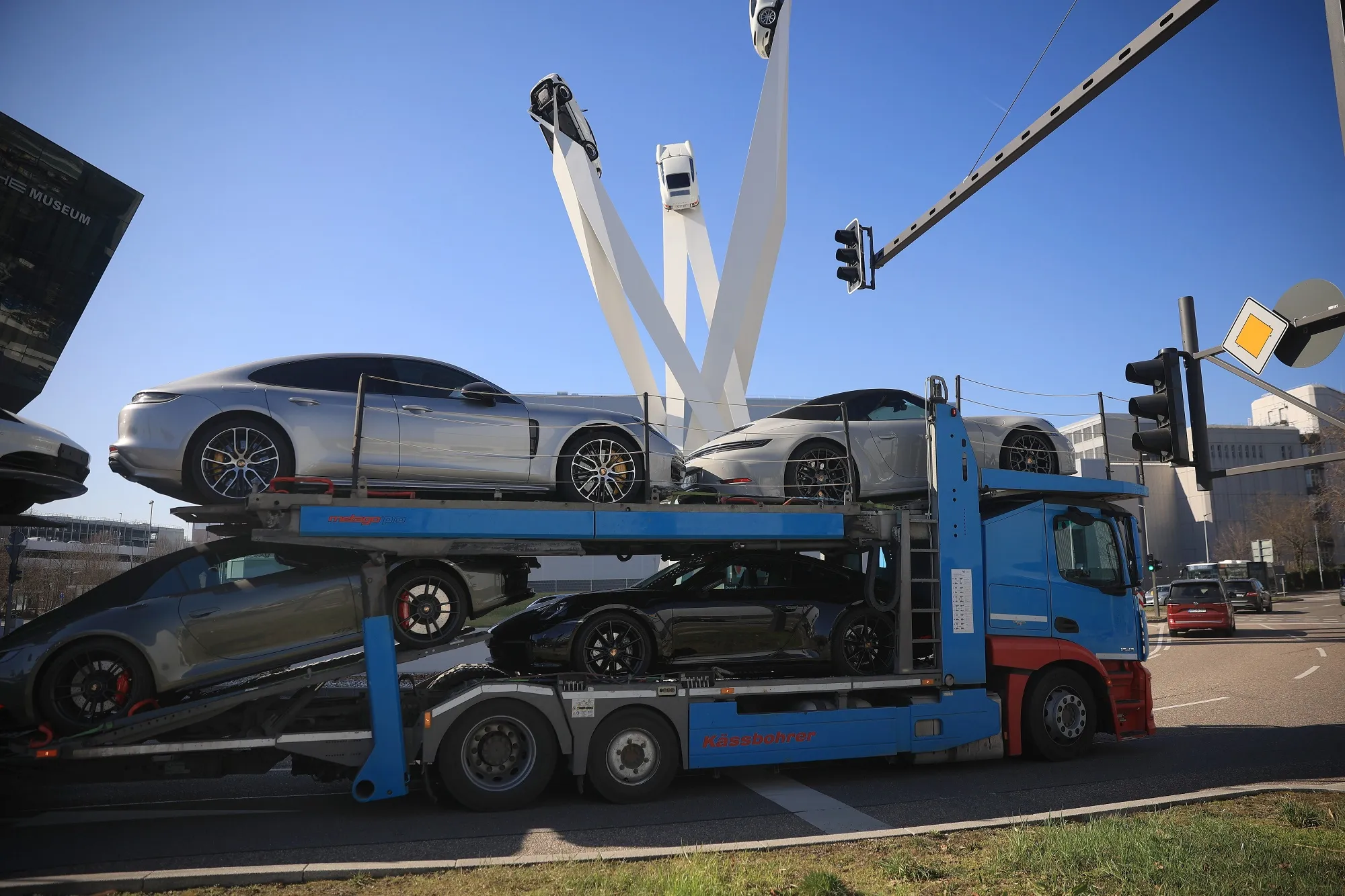 Porsche automobiles on a transporter outside the Porsche AG Zuffenhausen plant in Stuttgart, Germany.