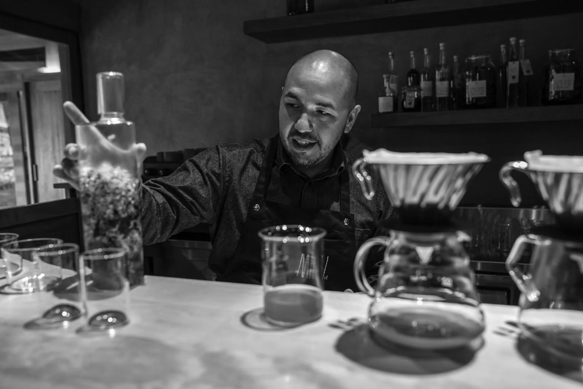 Jean Pierre Diaz stands behind the bar counter at MIL.