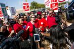 Elizabeth Warren speaks to members of the media during a United Auto Workers strike outside the General Motors Detroit-Hamtramck Assembly plant on Sept. 22.