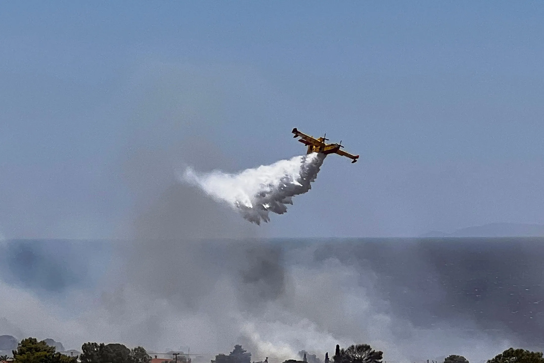 Water is dropped over wildfires in Palaia Fokaia, south of Athens, on June 26.