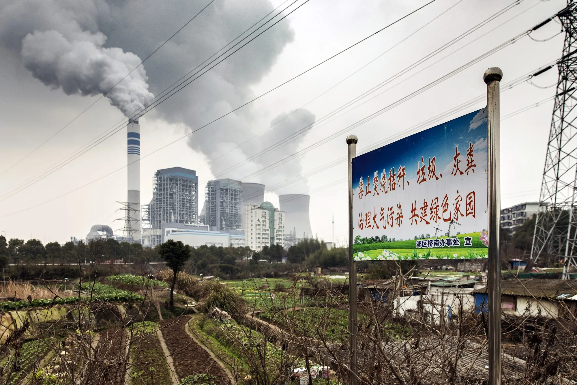 Emissions rise from cooling towers at a coal-fired power station in Tongling, China.