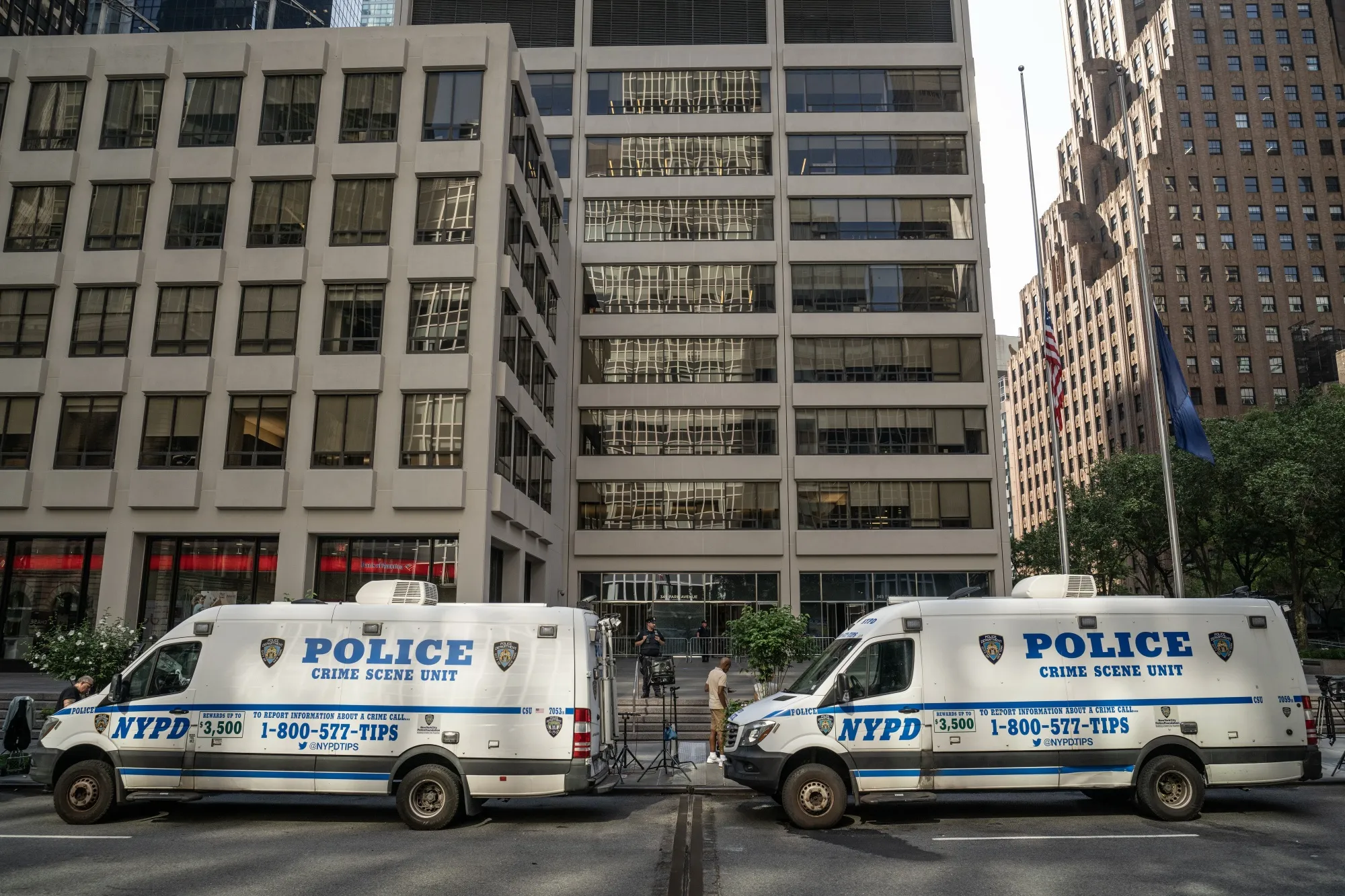 New York Police Department (NYPD) officers secure the scene of a shooting from Monday in New York.