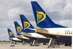 Ryanair airplanes waiting at airport gates