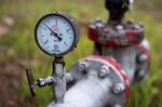 A pressure gauge sits attached to crude oil pipework in an oilfield near Almetyevsk, Russia, on Sunday, Aug. 16, 2020.