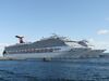 Ships from the Carnival cruise line are seen in Nassau, Bahamas on April 29, 2019. (Photo by Daniel SLIM / AFP) (Photo credit should read DANIEL SLIM/AFP via Getty Images)