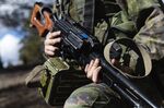 A soldier from the Finnish Defence Forces holds&nbsp;a PK machine gun during a&nbsp;training exercise, in Niinisalo, Finland.