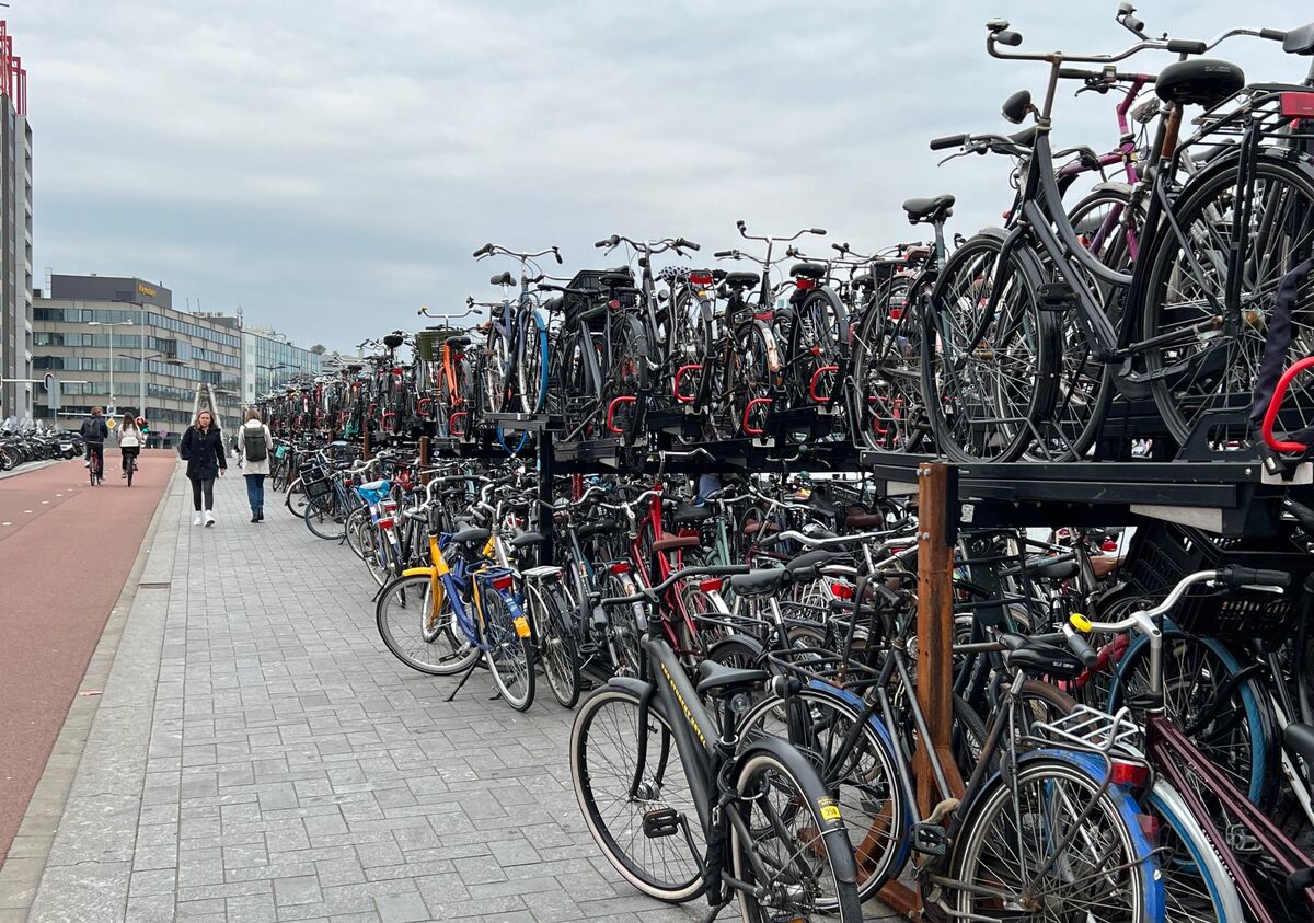 A bike parking facility in Amsterdam. Hundreds of bikes are visible on a compact two-layer structure.