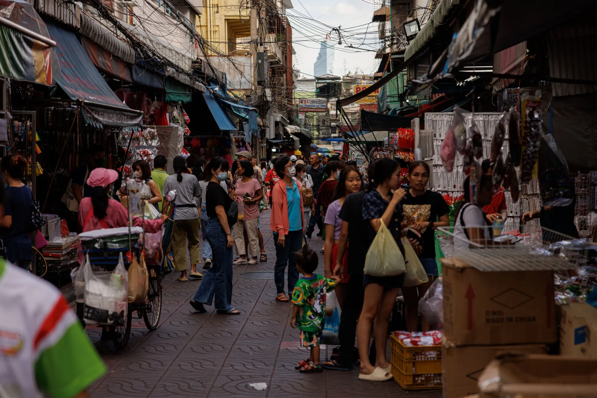 Shoppers at a market in Bangkok.