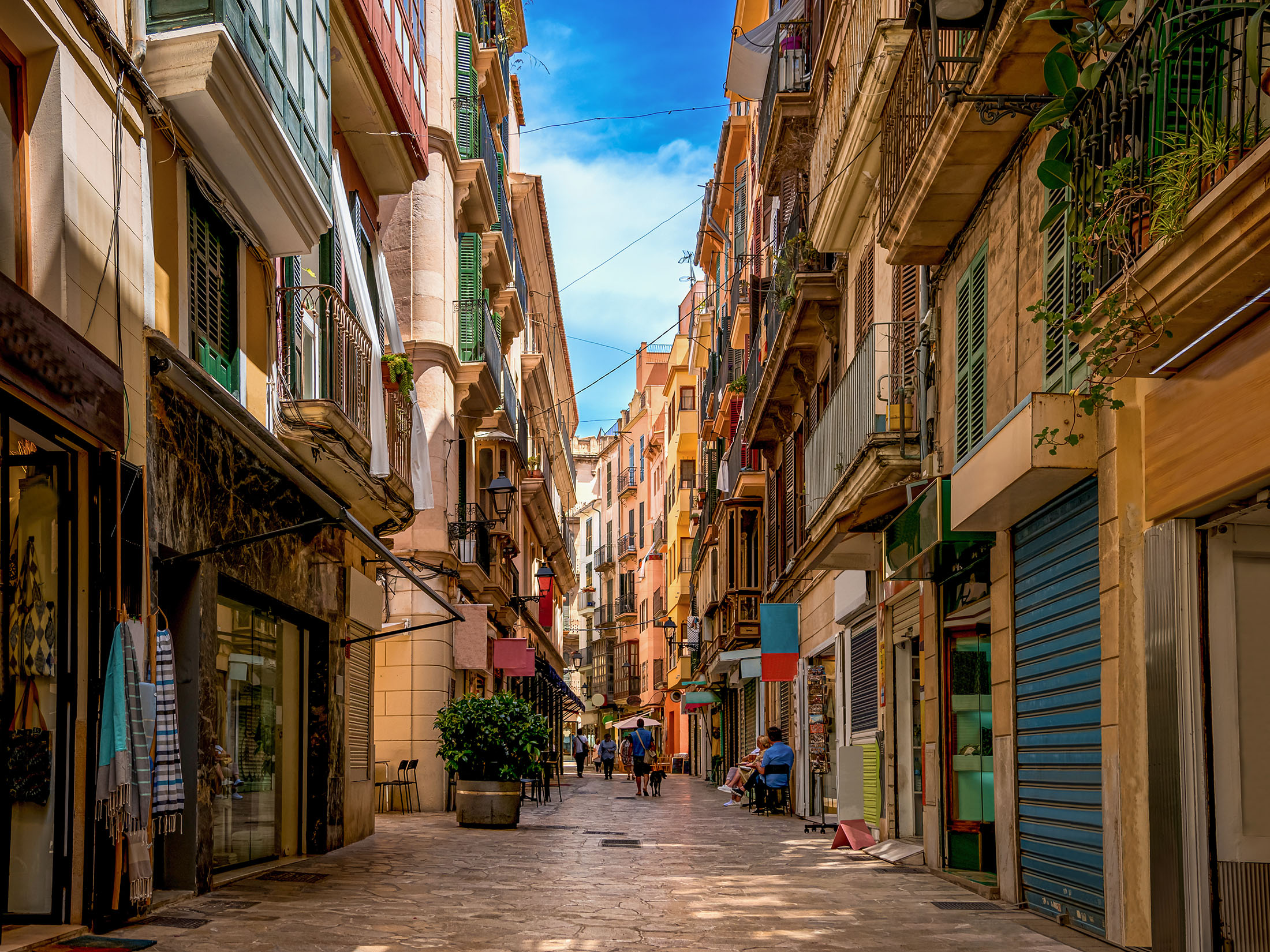 Traditional apartment buildings line a backstreet in Palma de Mallorca.