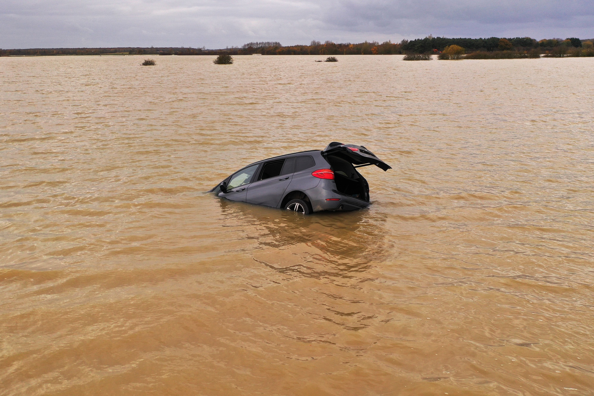 A luxury SUV sits&nbsp;submerged in floodwater in Lincoln, England.&nbsp;
