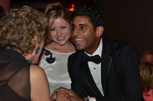 Amar Ramasar, far right, and his wife, Elysia greet a patron.