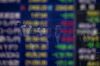 TOKYO, JAPAN - AUGUST 25: Pedestrians are seen reflected in an electronic screen showing global stock market information on the street in Tokyo on August 25, 2015. Japan's share prices dropped nearly 4.0 percent, closing at 17,806.70 following a 4.6% plunge on "Black Monday" to the lowest level seen since late February. (Photo by Chris McGrath/Getty Images)