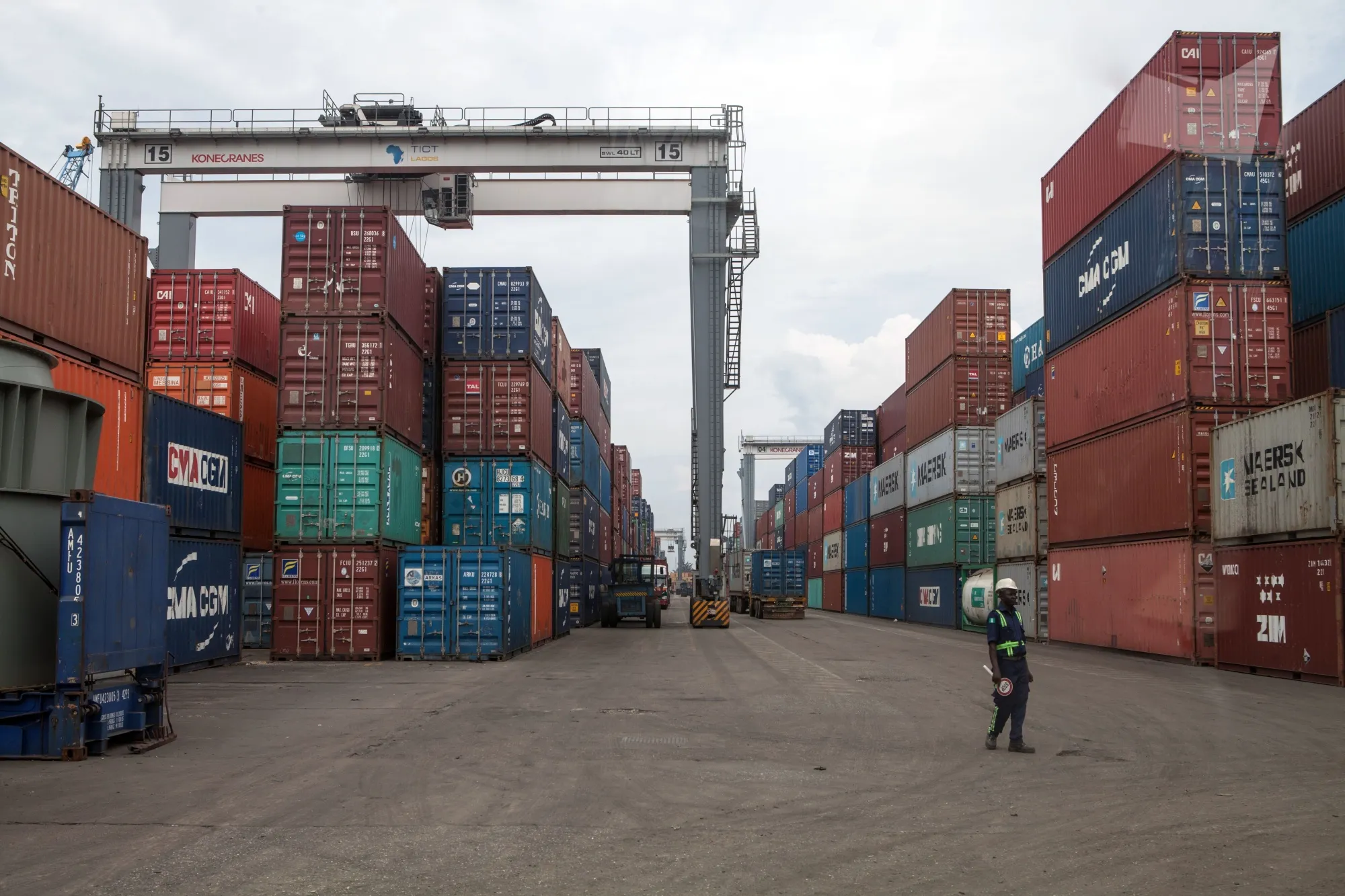 A member of the security stands among containers at the Lagos Tin-Can Island container terminal in Apapa.