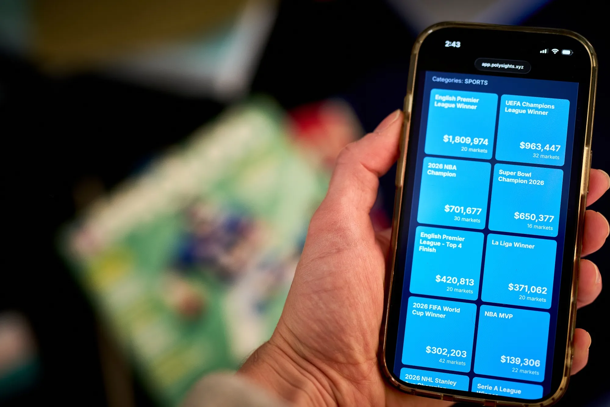 The Polysights analytics platform website Sports page for Polymarket traders arranged on a smartphone in New York.