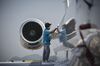 An employee cleans the surface of an Embraer SA Legacy 650 jet at the China International Aviation & Aerospace Exhibition.