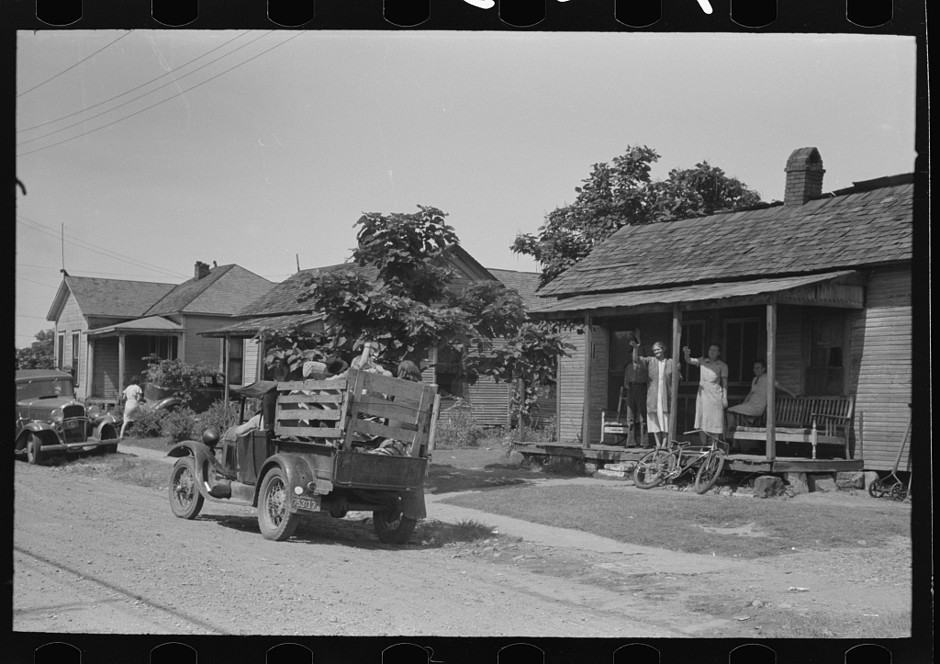 A migrant family leaves Muskogee, Oklahoma. July 1939.