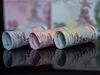 An assortment of Turkish Lira banknotes sit in this arranged photograph in London, U.K., on Wednesday, Aug. 15, 2018. Turkey took its boldest steps yet to try to ward off a financial crisis by making it harder for traders to bet against the battered lira and easing rules on restructuring troubled loans that have already topped $20 billion.