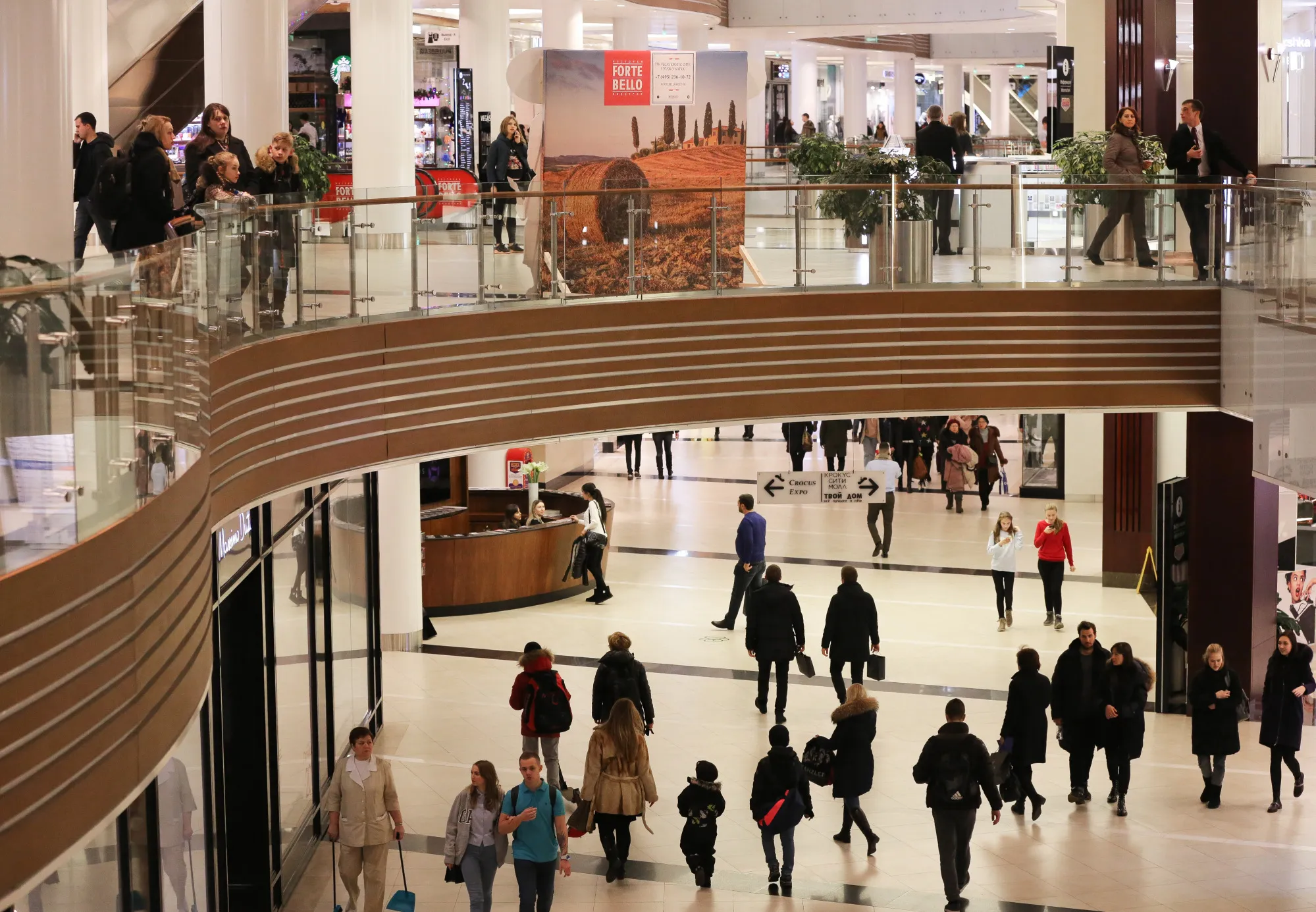 Shoppers walk through the Vegas shopping mall during Black Friday sales in Moscow.