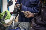 An attendant refuels a motorcycle taxi, known locally as a “boda boda,” in the Baba Dogo suburb of Nairobi.