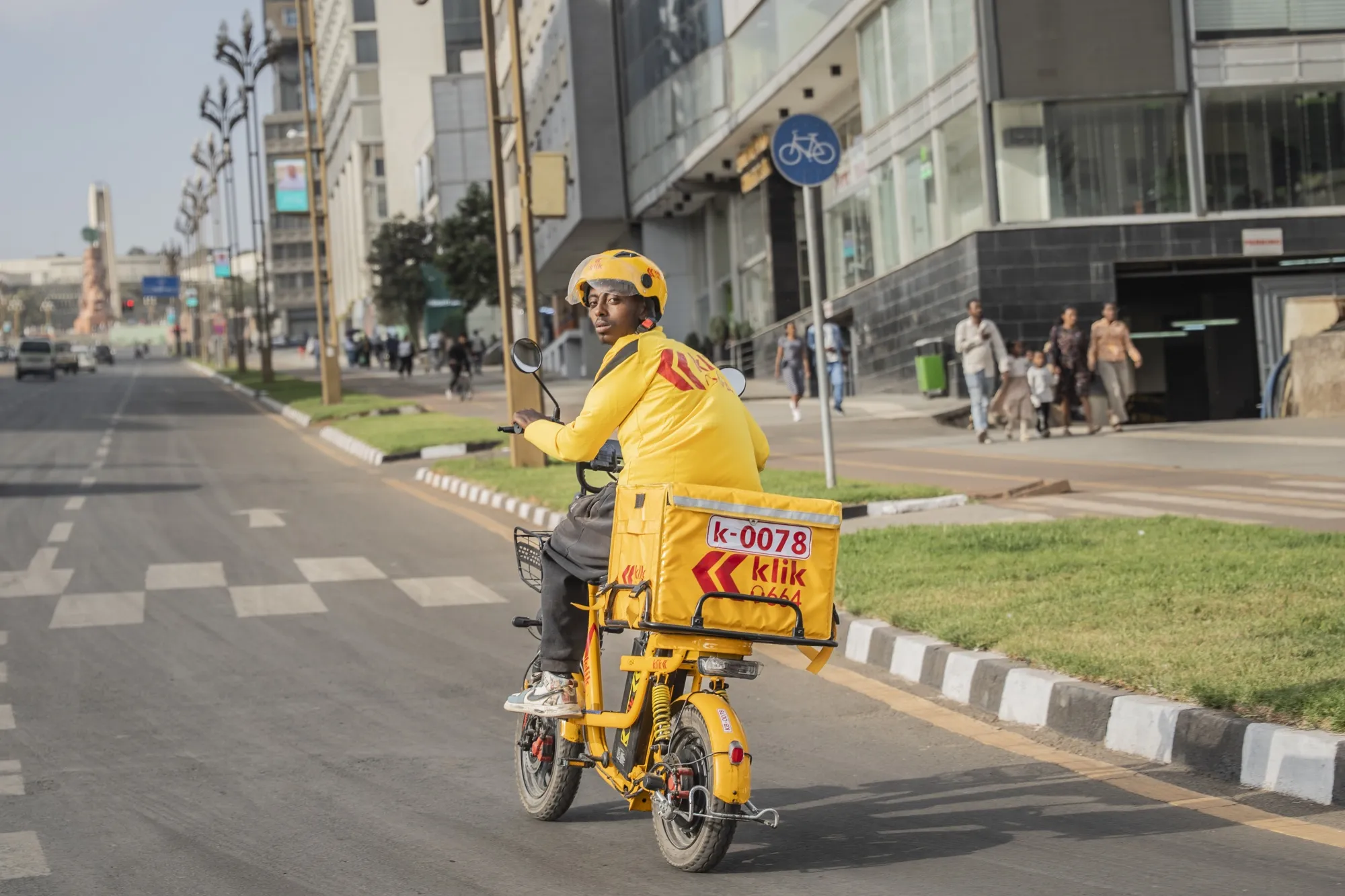 A delivery rider for Klik, a logistics company that supplies everything from meals to medicines, on his electric bike.