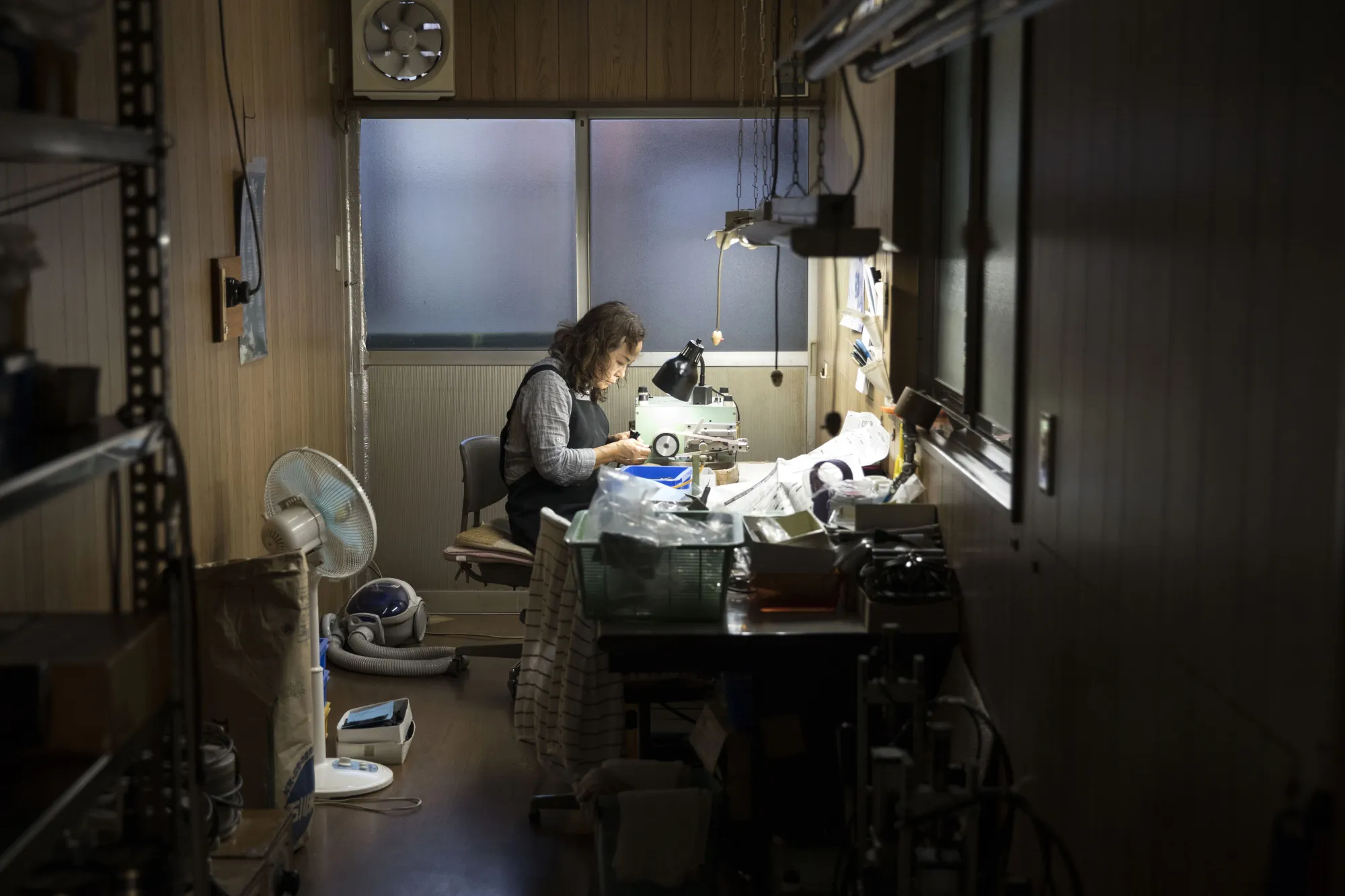 A female worker makes eyeglasses temples at Nagai Co. factory in Sabae, Fukui Prefecture. Photographer: Shiho Fukada/Bloomberg

